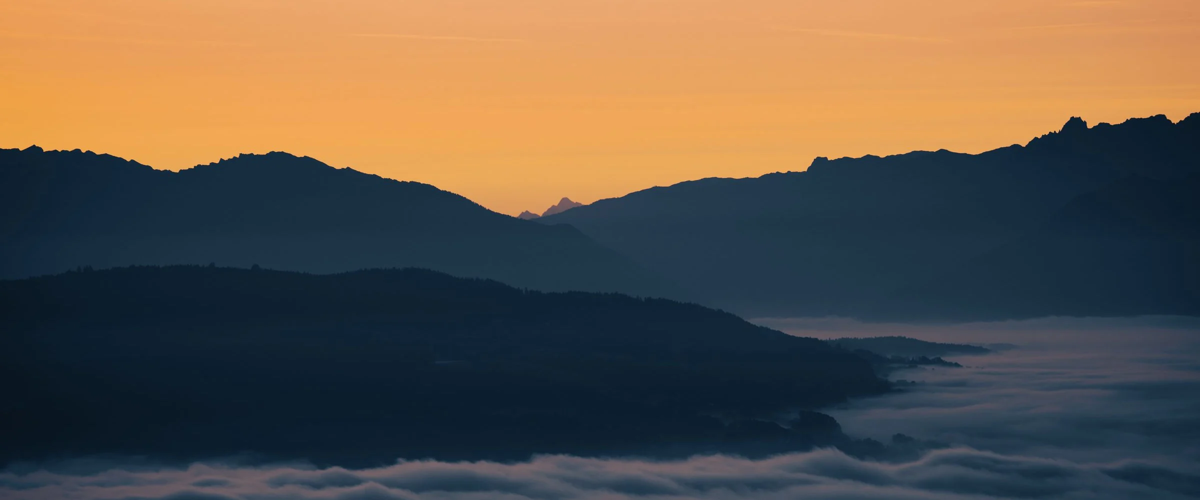 Mountain ridges above a valley of fog at sunrise in Washington