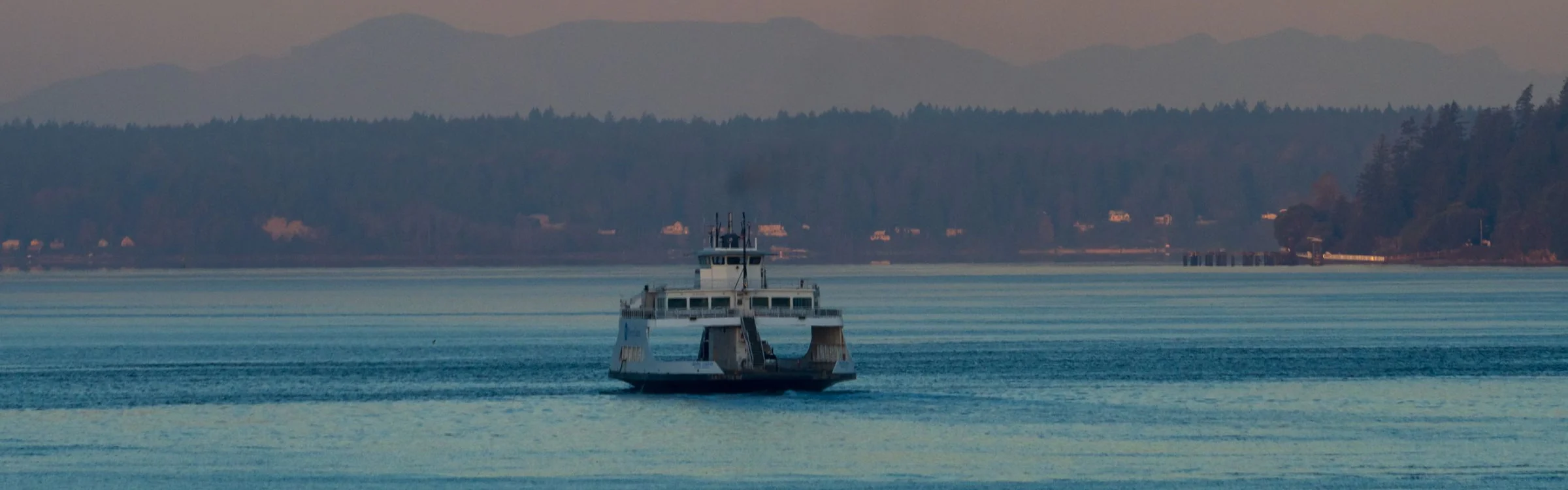 A ferry crossing calm water at twilight near Steilacoom, Washington